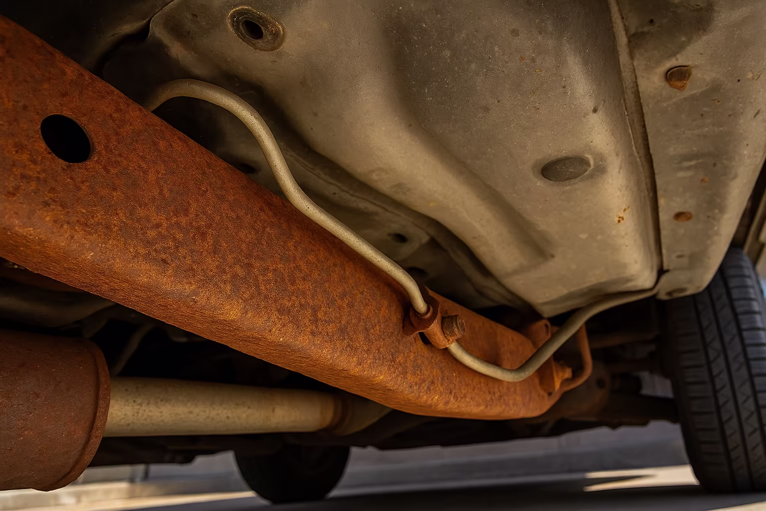 Close-up of surface rust on a vehicle underbody